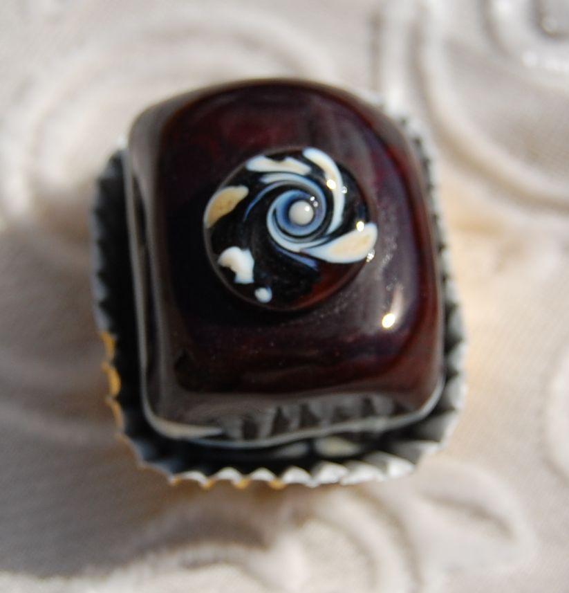 Dark chocolate decorated with a whirl of milk chocolate