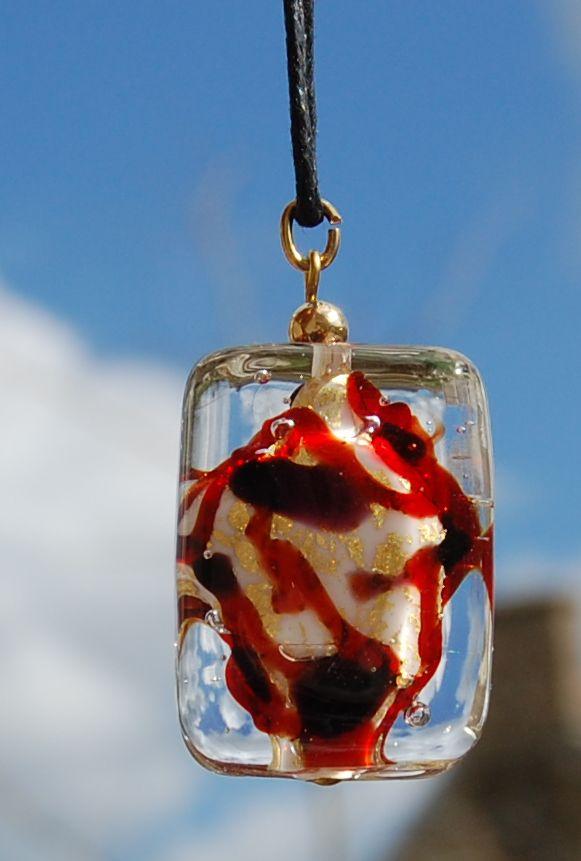 Pendant, white, black, red and gold